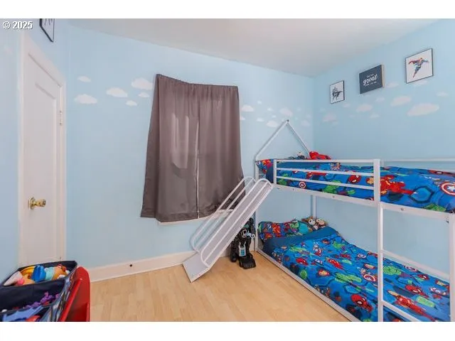 a room with toys and wooden floor