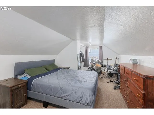 a view of a livingroom with furniture and a window