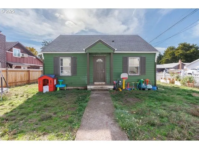a front view of a house with garden