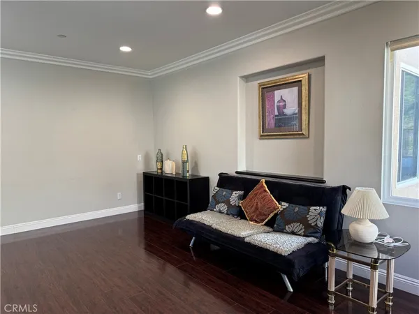 a bedroom with furniture and a lamp