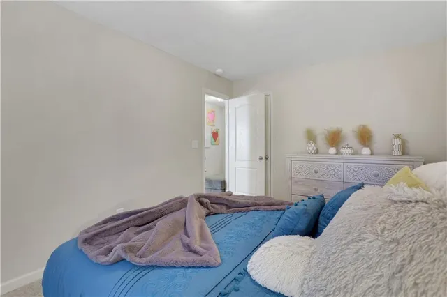 a living room with furniture and white wall