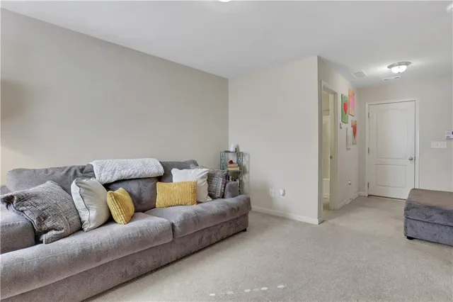 a living room with furniture and a couch