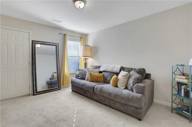 a living room with furniture and a couch