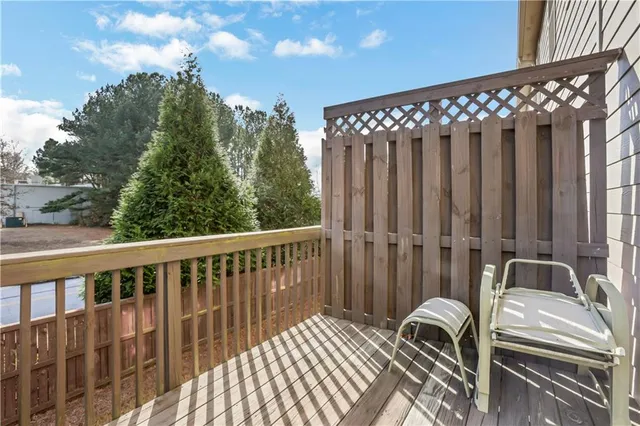 a view of balcony with wooden floor