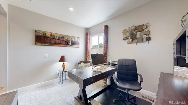 a view of a livingroom with furniture and toys