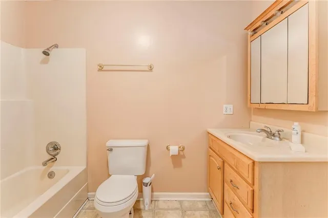 a view of a livingroom with a ceiling fan and window