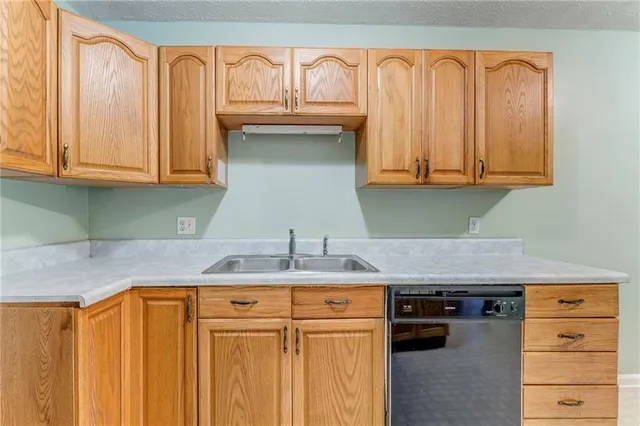 a bedroom with a bed and a black walk in closet