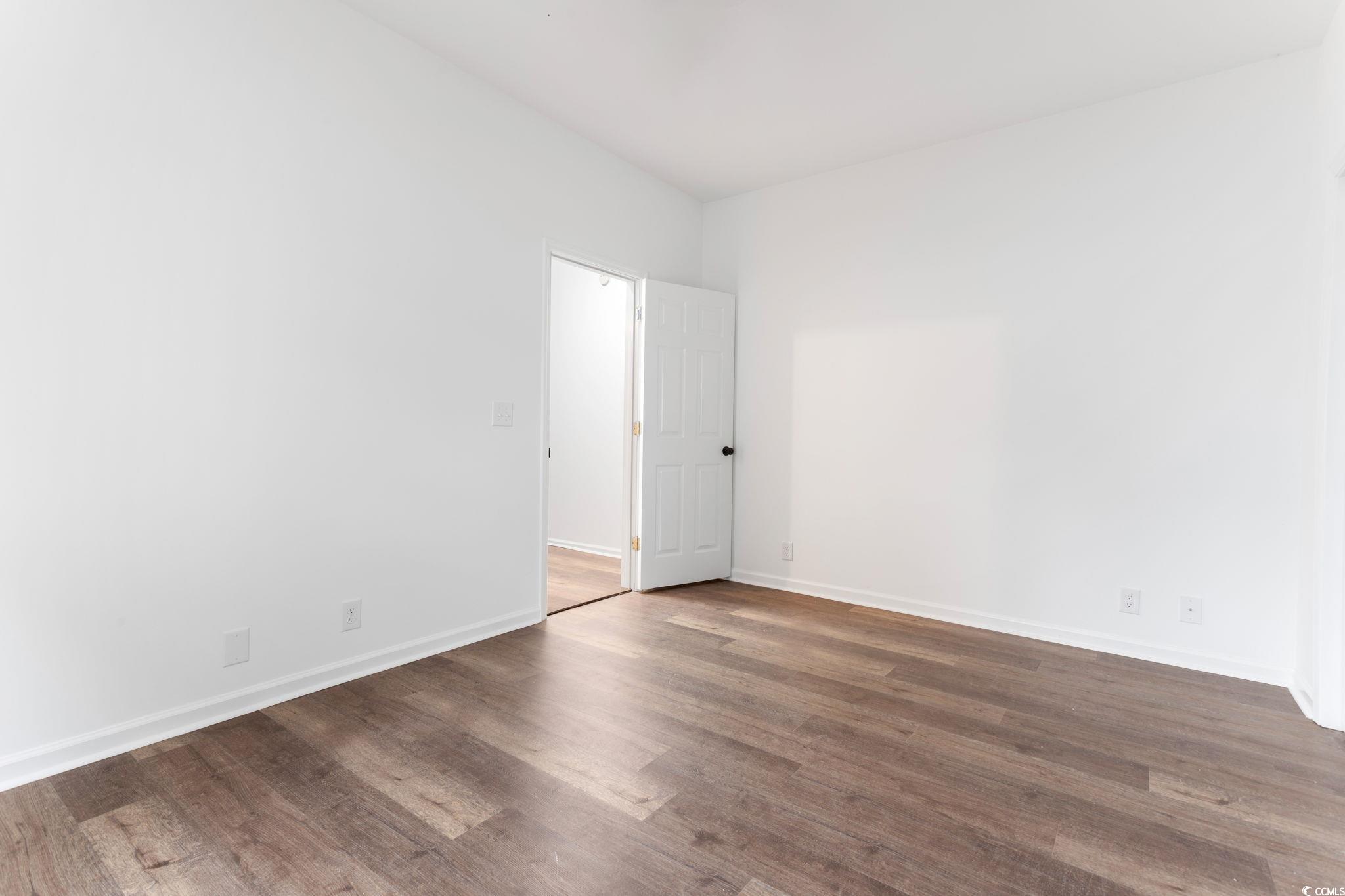 2321 Brick Drive Longs, SC 29568 - Photo 14 of 40 Unfurnished room with dark wood finished floors and baseboards