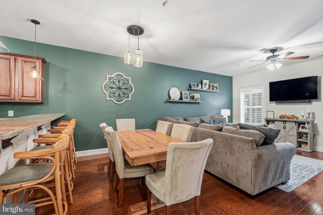 a view of a livingroom with furniture and a flat screen tv