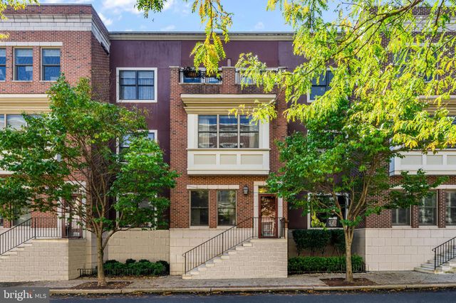 a front view of a building with garden