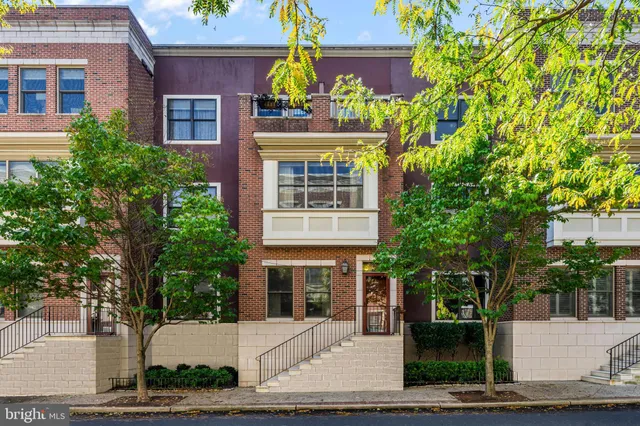 a front view of a building with garden