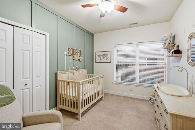 a view of a bedroom with windows
