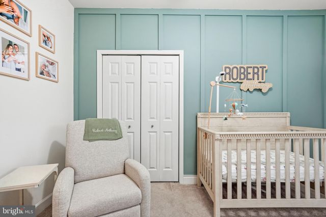 a bedroom with a bed and a table