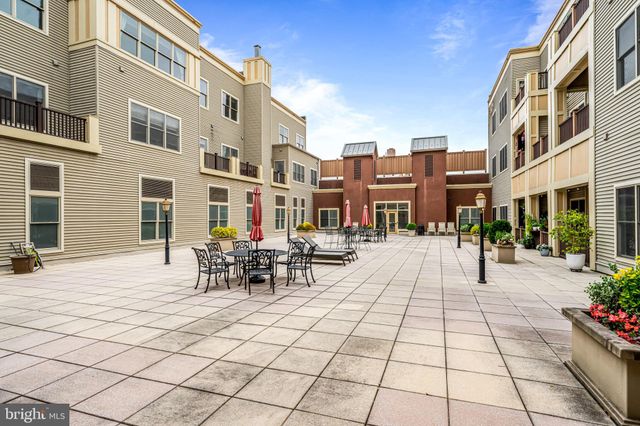 a front view of a building and outdoor seating