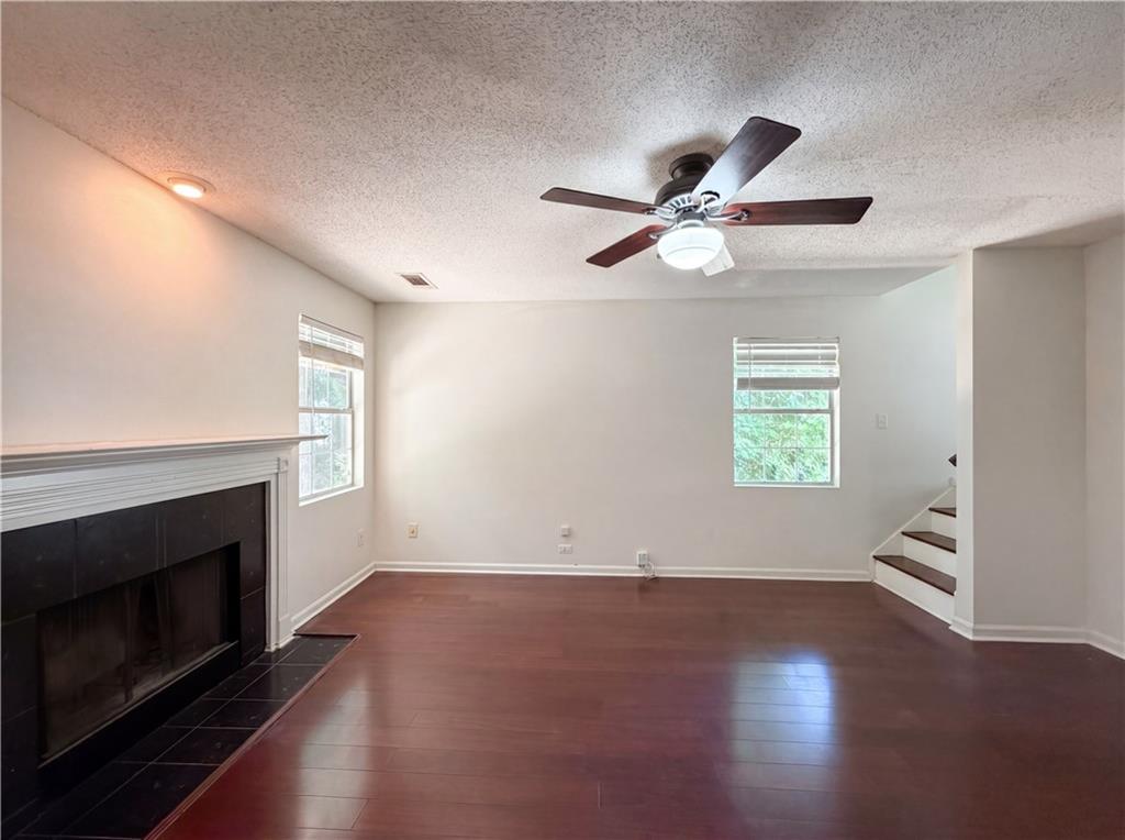 3753 Soapstone Road Decatur, GA 30034 - Photo 10 of 26 an empty room with windows and fireplace