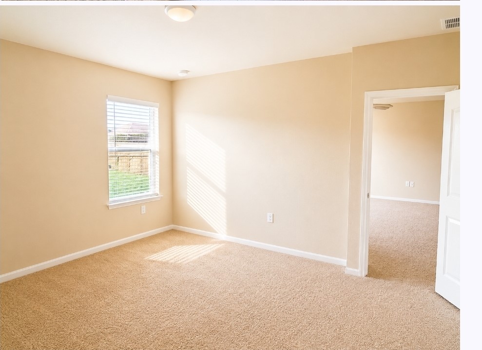 11640 Cambrian Road Manor, TX 78653 - Photo 11 of 15 a view of an empty room with a window