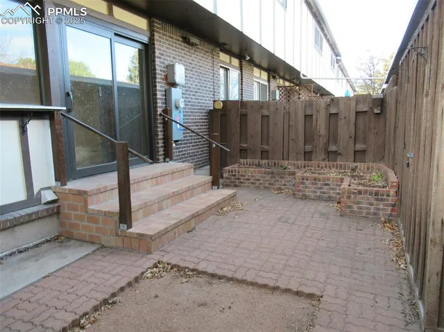 a view of entrance gate of a house