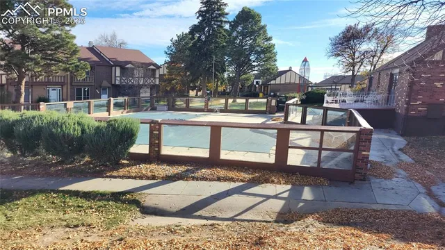 a view of a backyard with sitting area