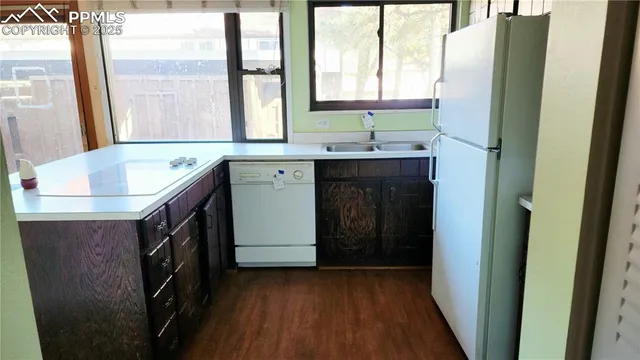 a bathroom with a double vanity sink and a tub