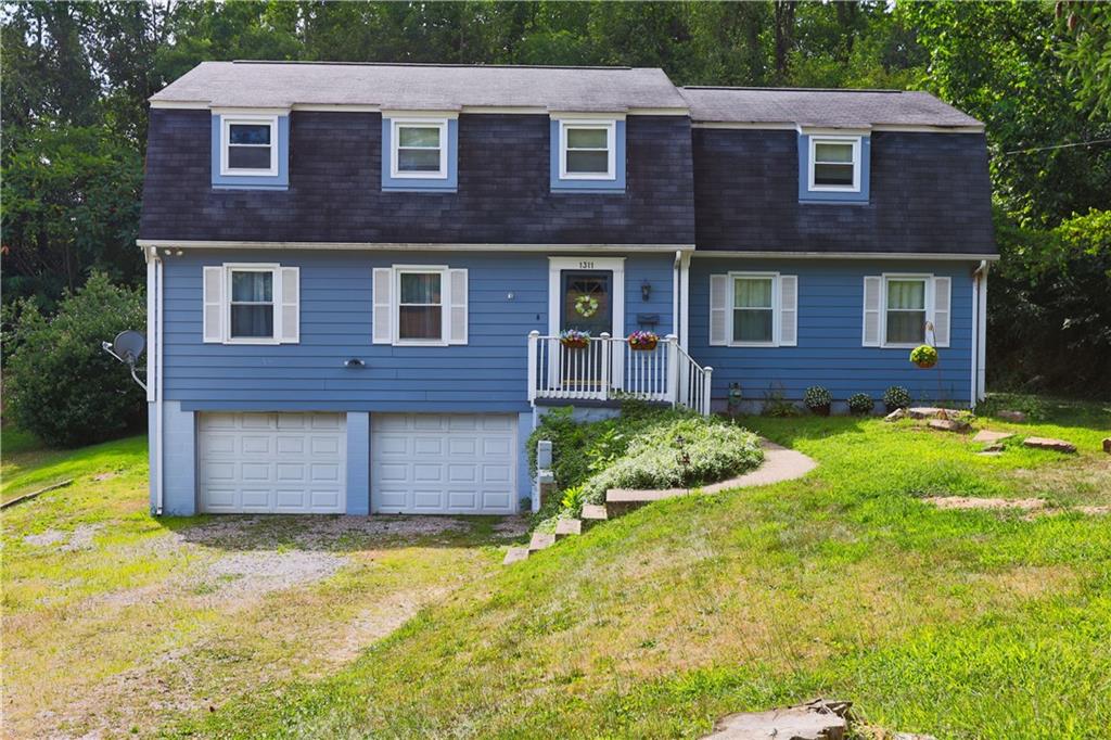 a front view of a house having yard