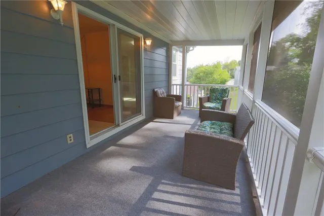 a view of a porch with furniture