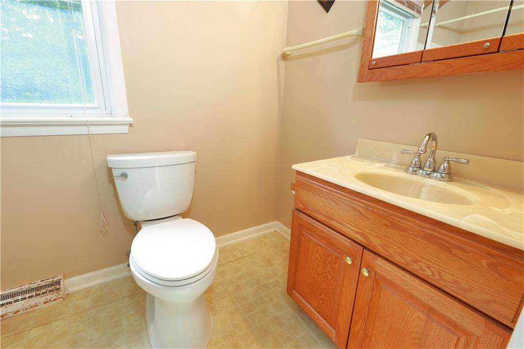 1311 19th Avenue Beaver Falls, PA 15010 - Photo 18 of 40 a bathroom with a toilet sink and mirror