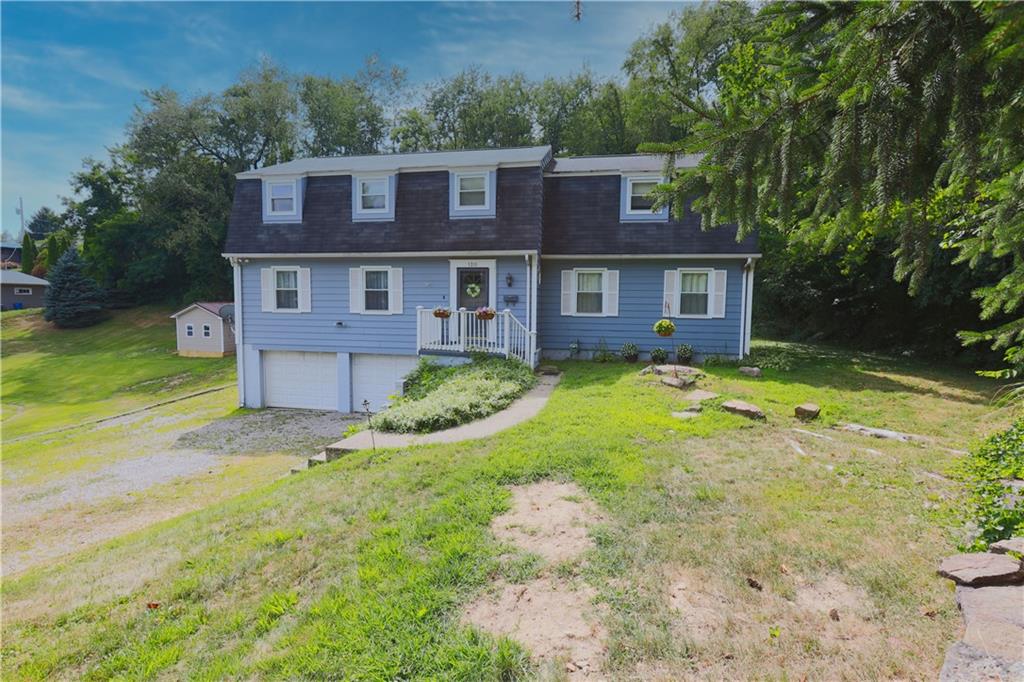 1311 19th Avenue Beaver Falls, PA 15010 - Photo 2 of 40 front view of a house with a yard