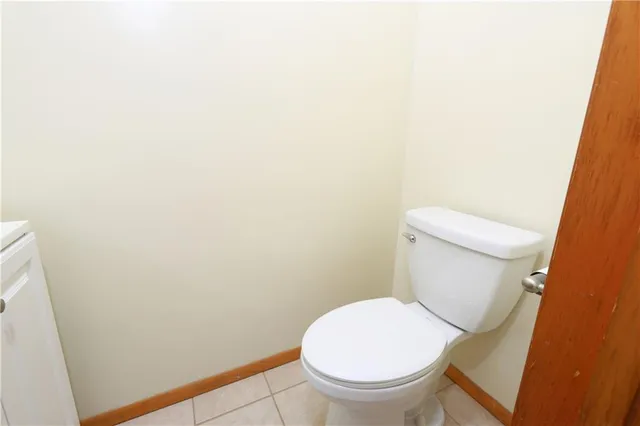 a view of hallway with bathroom