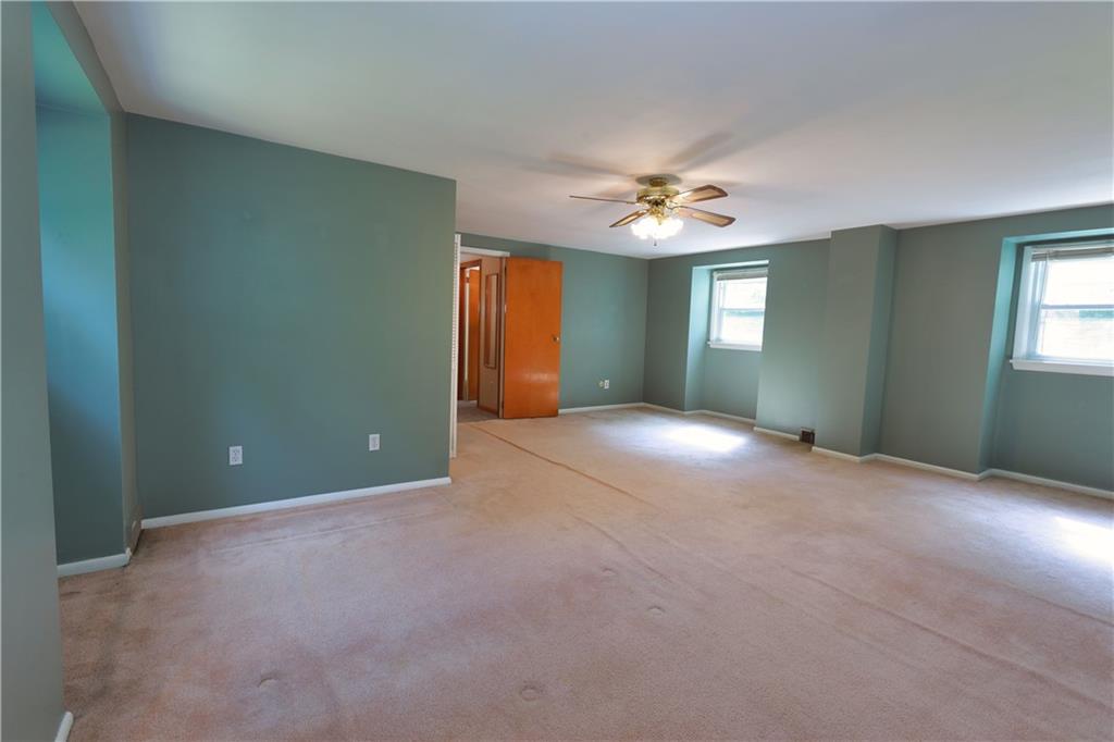 1311 19th Avenue Beaver Falls, PA 15010 - Photo 26 of 40 an empty room with windows and fan
