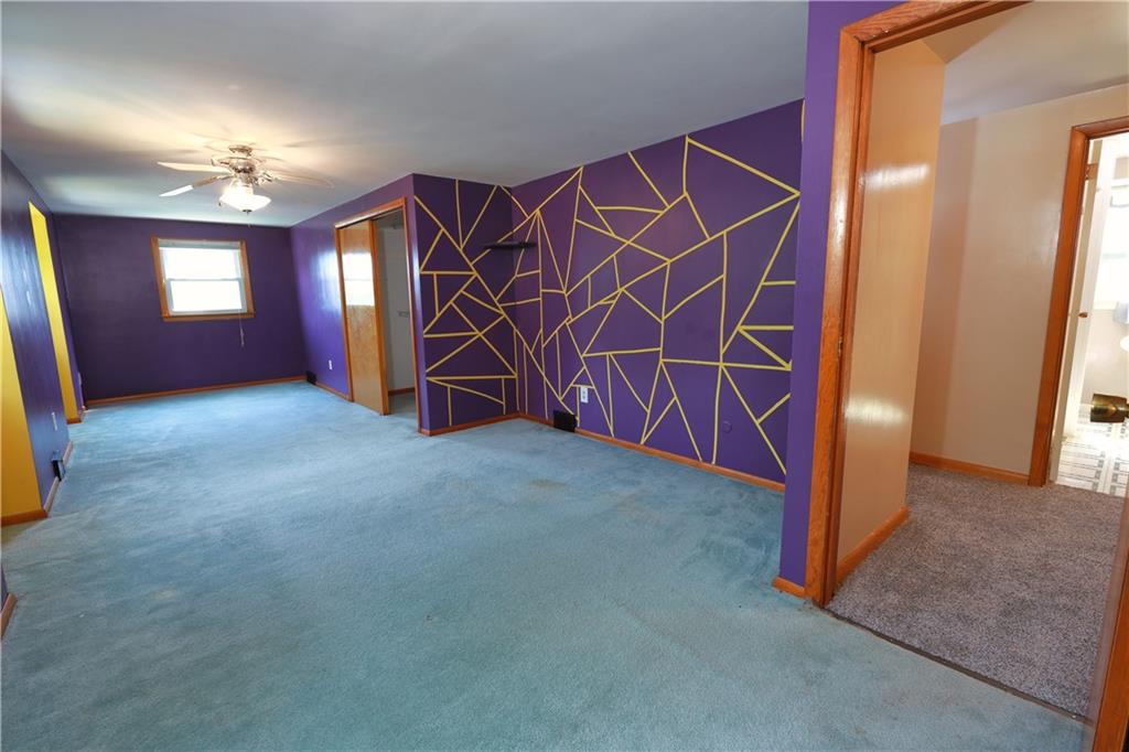 1311 19th Avenue Beaver Falls, PA 15010 - Photo 31 of 40 an empty room with windows and ceiling fan