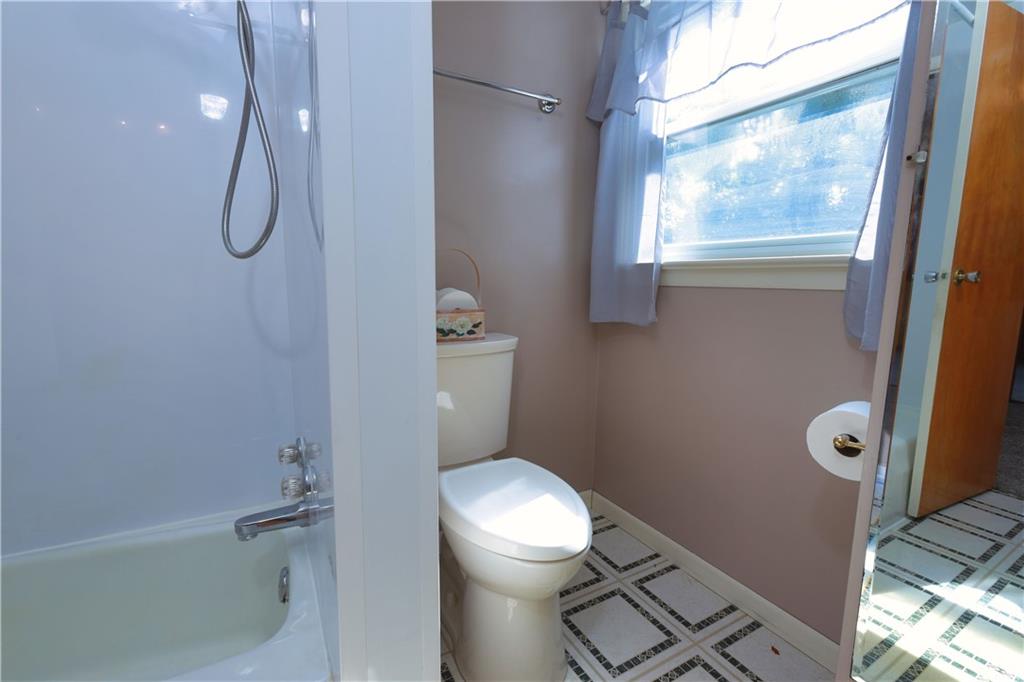 1311 19th Avenue Beaver Falls, PA 15010 - Photo 34 of 40 a bathroom with a granite countertop toilet and a shower