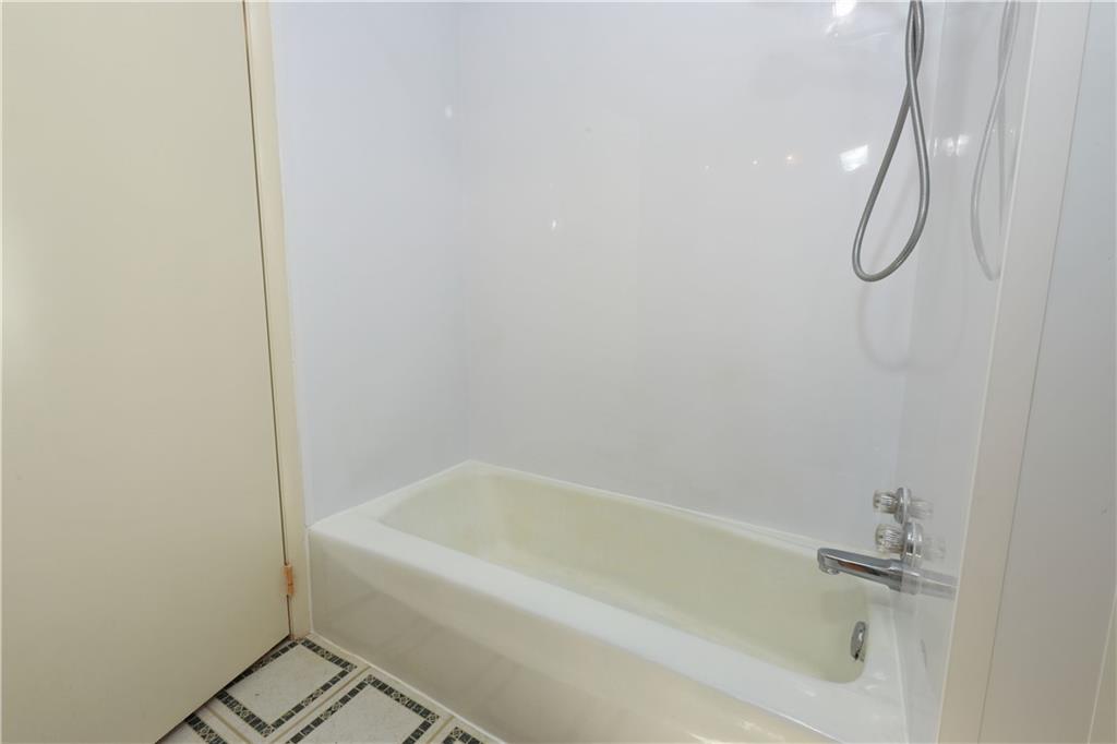 1311 19th Avenue Beaver Falls, PA 15010 - Photo 35 of 40 a bathroom with a bath tub with a shower