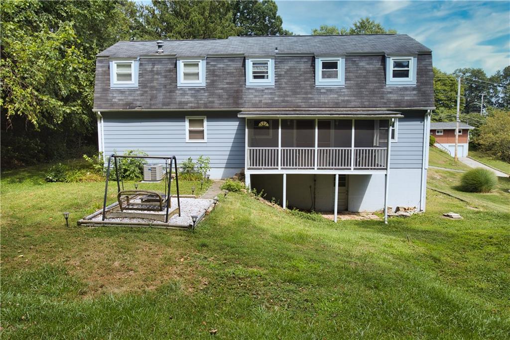 1311 19th Avenue Beaver Falls, PA 15010 - Photo 37 of 40 a view of a house with a yard and sitting area
