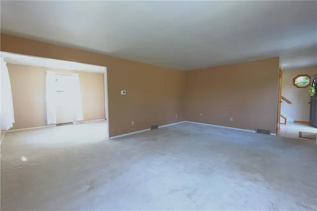 a view of an empty room and window