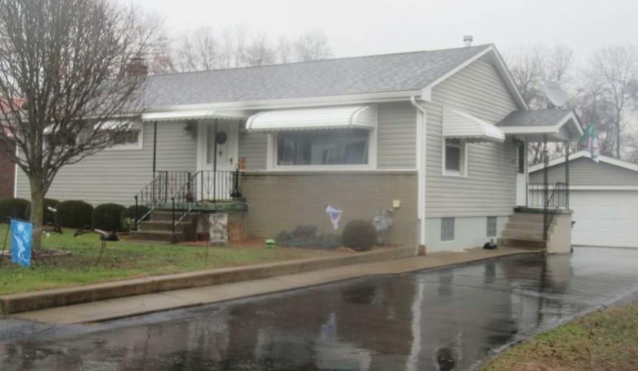 1421 Davidson Street Wampum, PA 16157 - Photo 3 of 3 a front view of a house with garden
