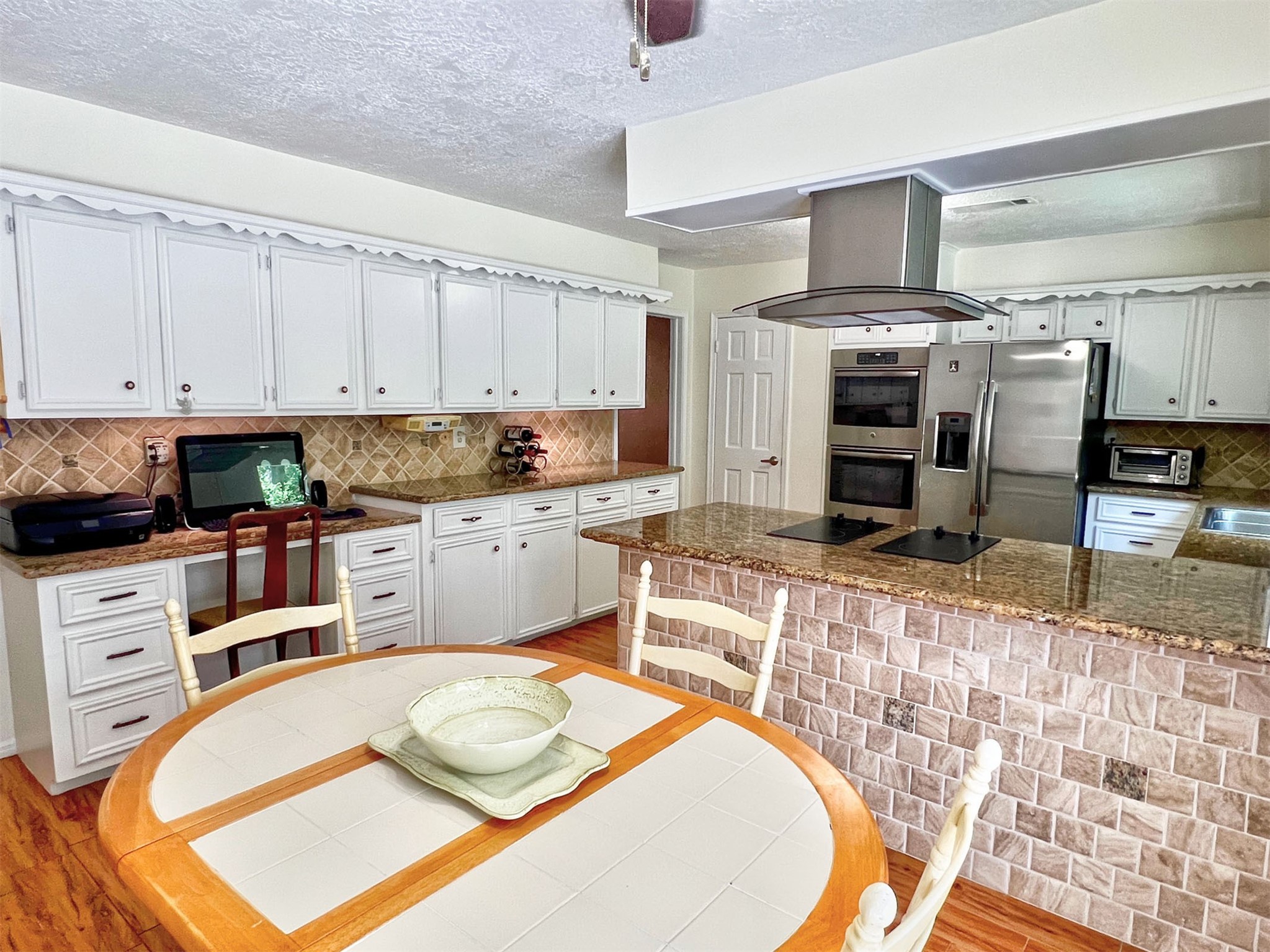 16902 Summit Oaks Lane Spring, TX 77379 - Photo 25 of 49 a kitchen with stainless steel appliances granite countertop a sink and cabinets