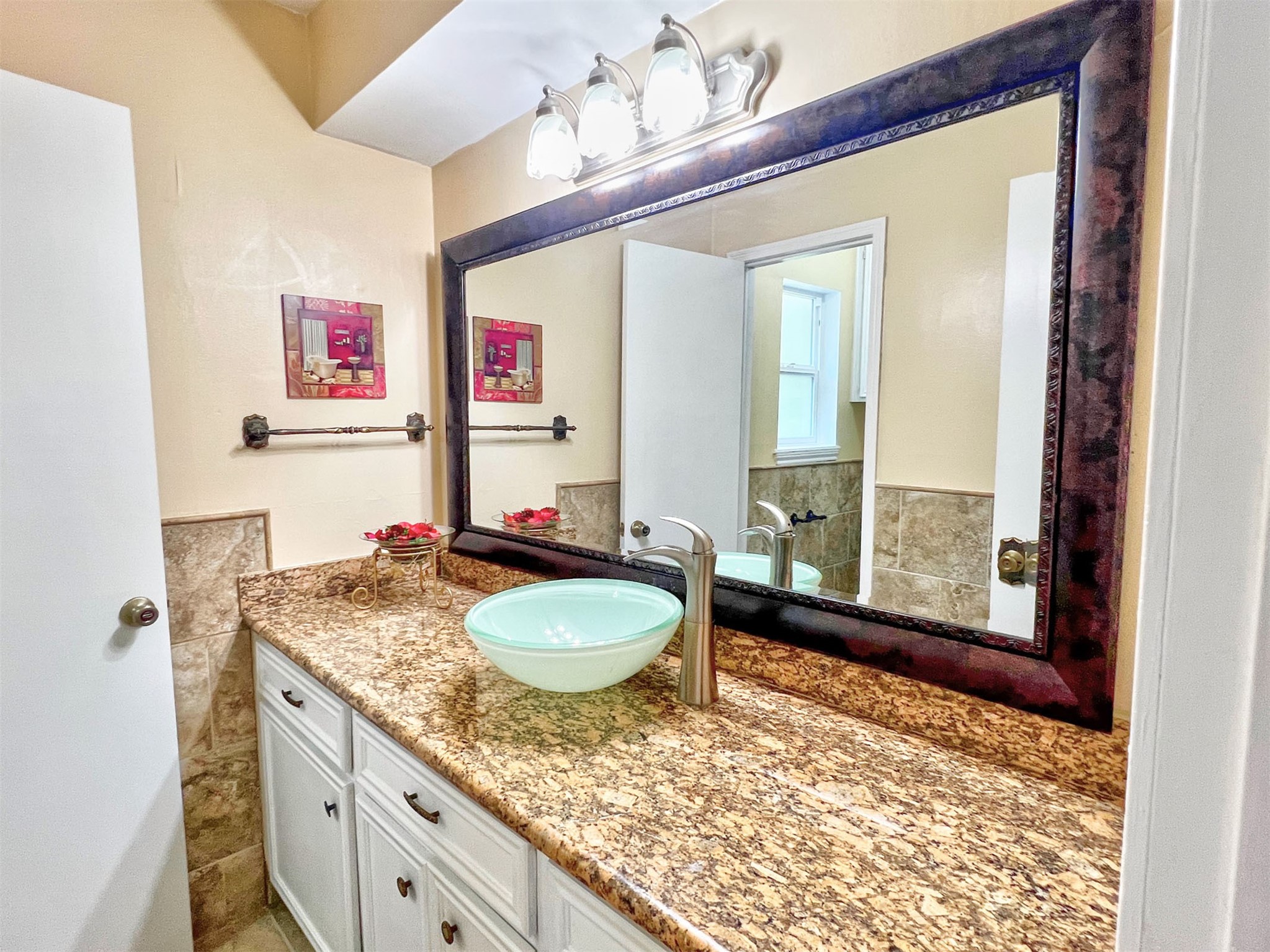 16902 Summit Oaks Lane Spring, TX 77379 - Photo 35 of 49 a bathroom with a granite countertop sink and a mirror