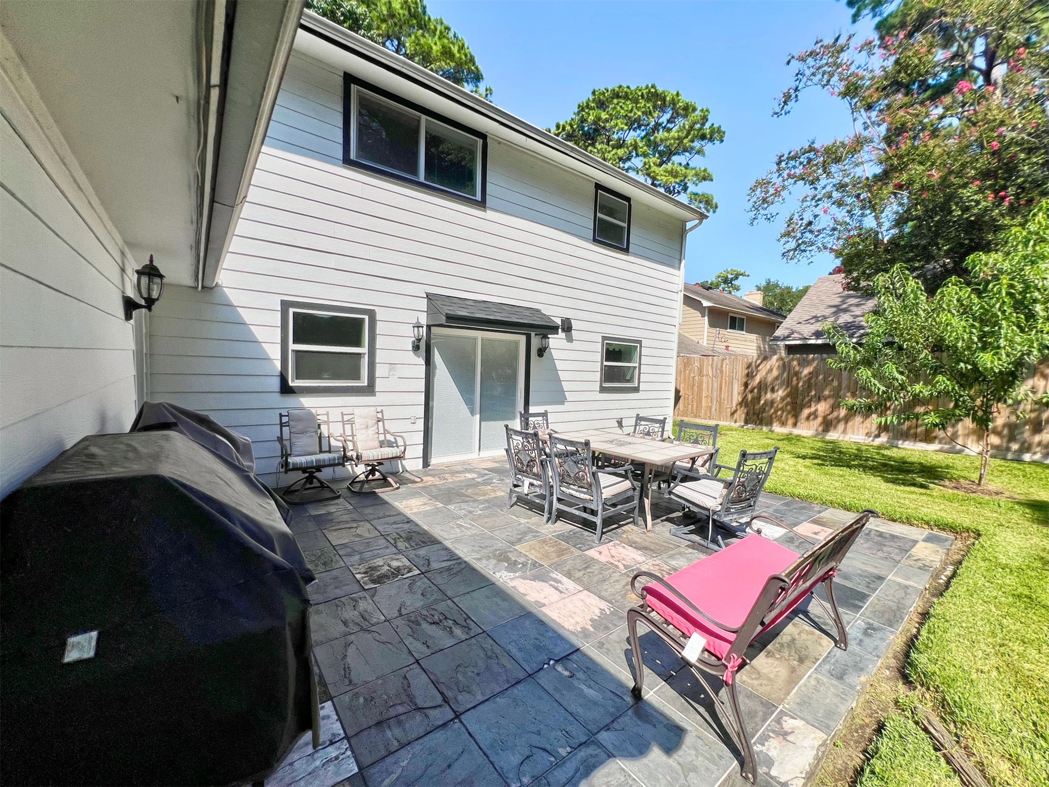 16902 Summit Oaks Lane Spring, TX 77379 - Photo 44 of 49 a view of a backyard with sitting area