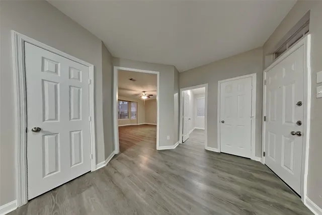 a view of a livingroom with wooden floor