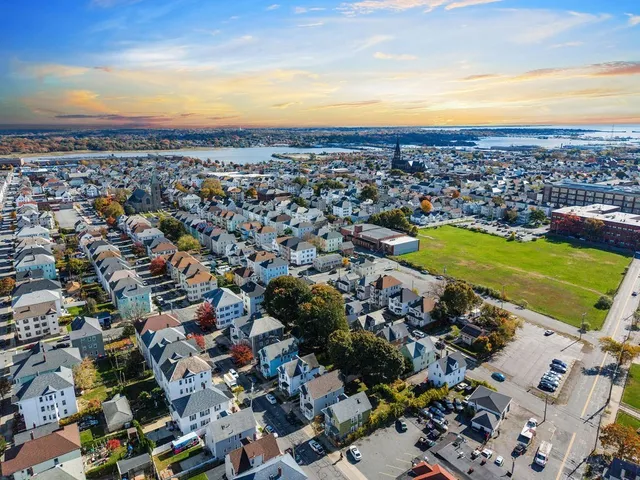 an aerial view of residential houses with outdoor space