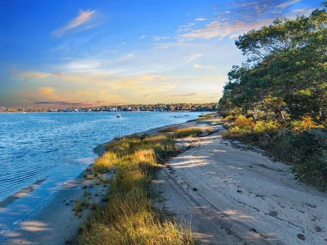 a view of a lake with beach and ocean view
