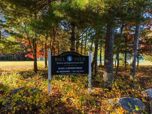 a large kitchen with granite countertop a sink a granite counter top and cabinets