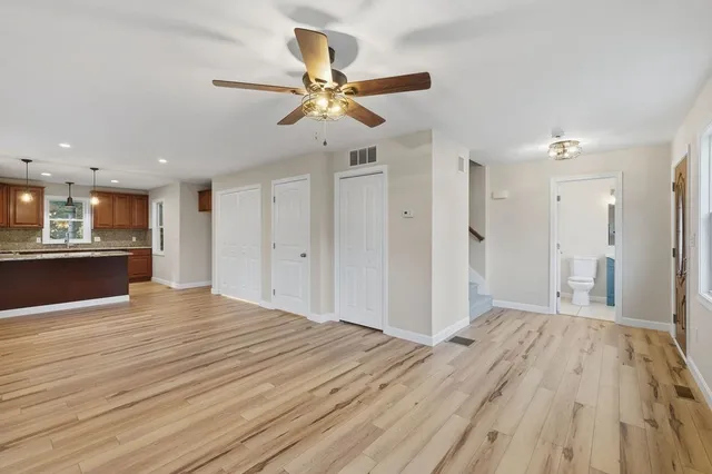 a large kitchen with stainless steel appliances granite countertop a granite counter tops and a window
