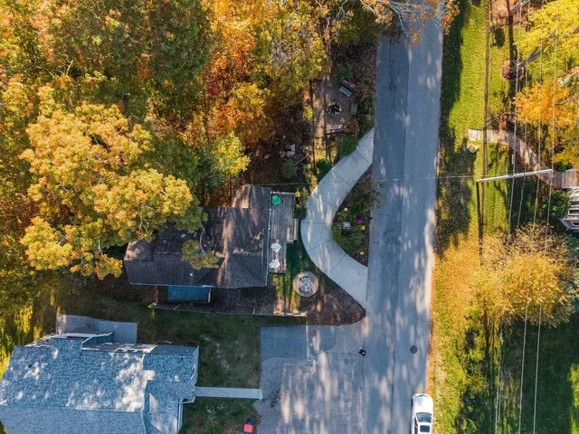 front view of a house with a tree
