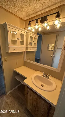 a view of a room with wooden floor and windows