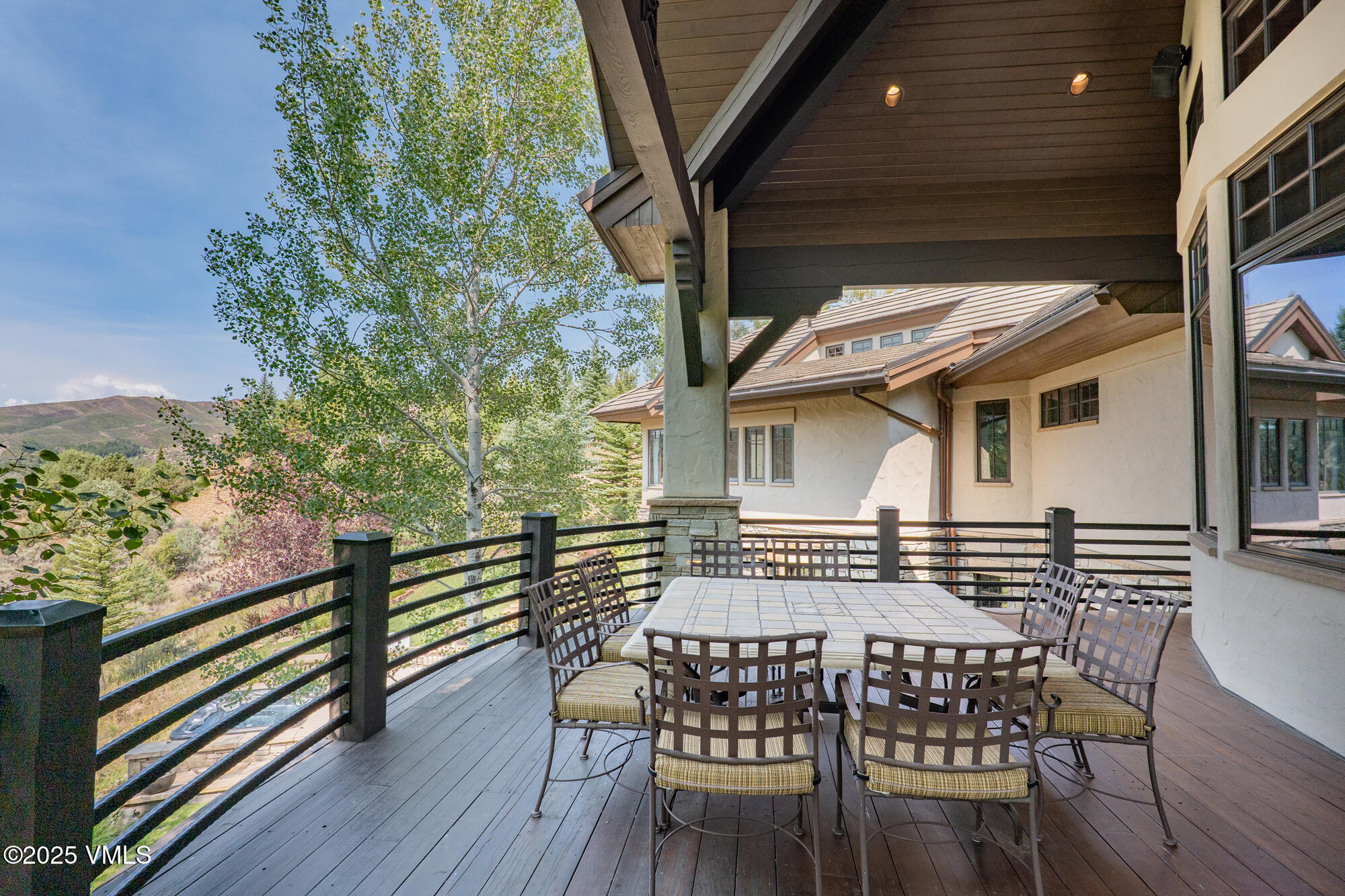 135 Andorra Road Edwards, CO 81632 - Photo 11 of 82 a view of a chairs and table on the wooden deck