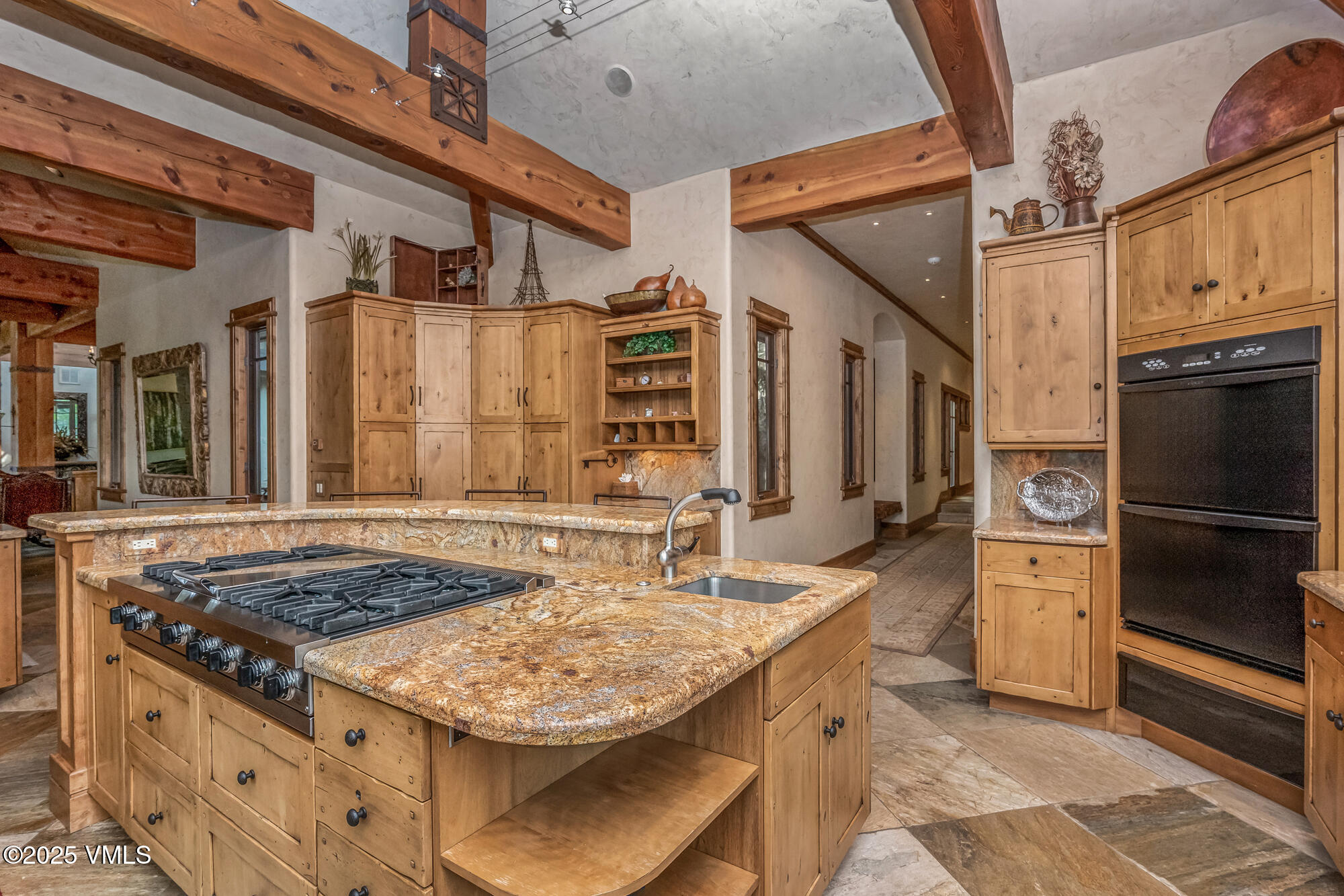 135 Andorra Road Edwards, CO 81632 - Photo 15 of 82 a kitchen with stainless steel appliances granite countertop a stove and a refrigerator
