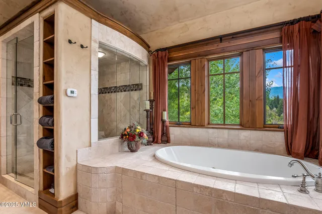 a bedroom with a bed and a fireplace