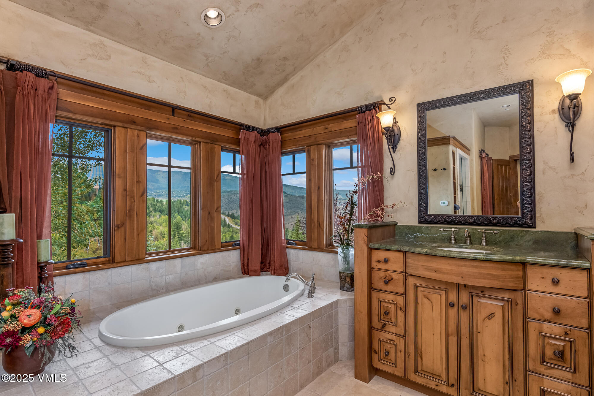 135 Andorra Road Edwards, CO 81632 - Photo 21 of 82 a bathroom with a granite countertop tub sink and mirror