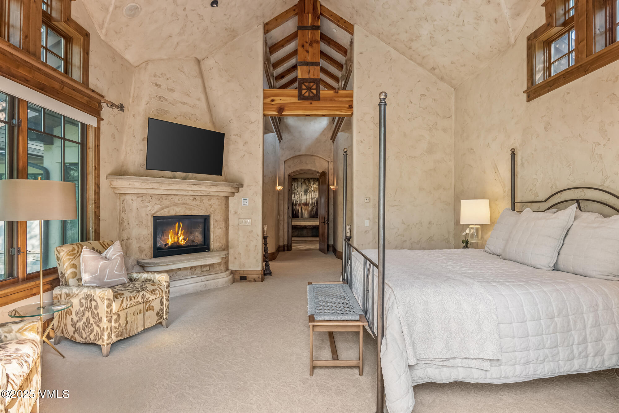 135 Andorra Road Edwards, CO 81632 - Photo 26 of 82 a bedroom with a bed and a fireplace